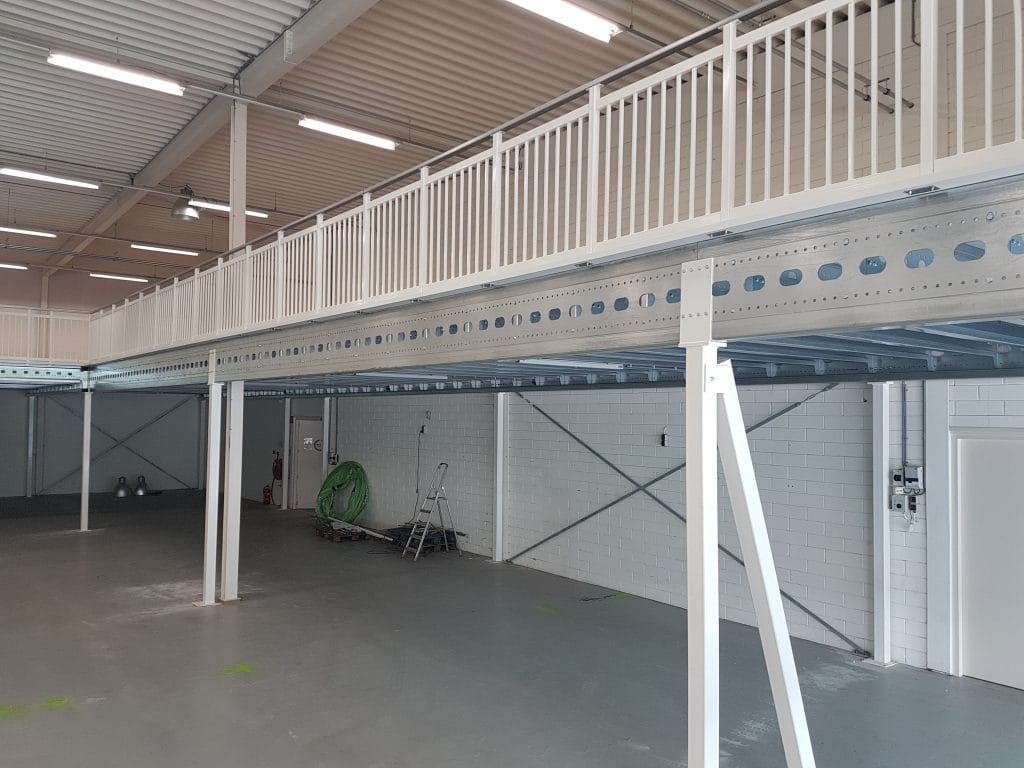 Mezzanine flooring system with white handrails