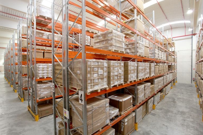 Pallet racking project with orange beams and boxed stock